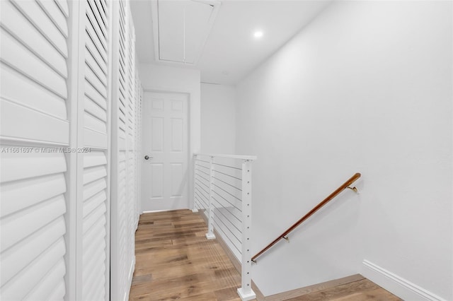 staircase featuring hardwood / wood-style flooring