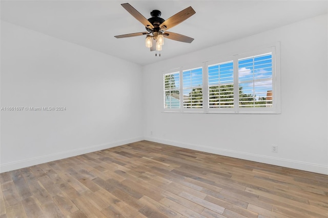 unfurnished room with light hardwood / wood-style flooring and ceiling fan