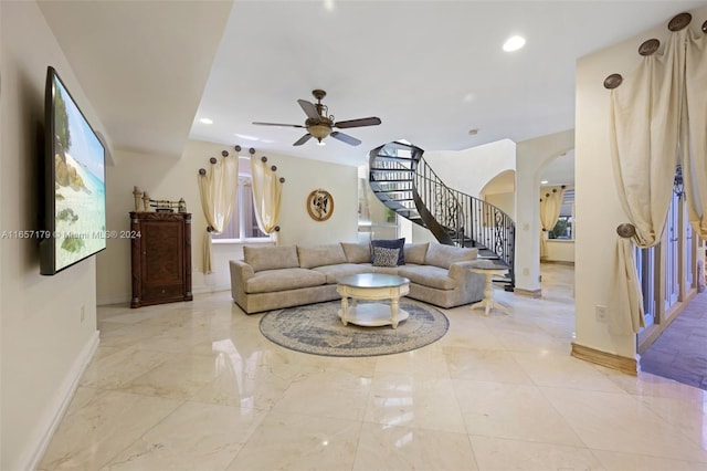 9580 Byron Ave, Surfside, FL 33154 - living room featuring arched walkways, stairway, ceiling fan, recessed lighting, and light marble finish floors