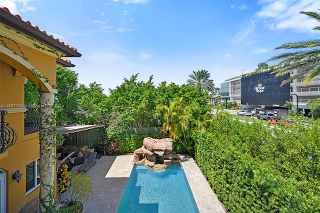 view of pool featuring a patio