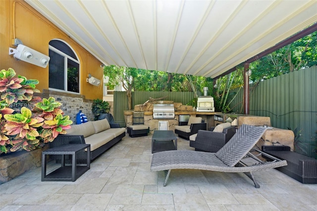 view of patio featuring grilling area, an outdoor kitchen, and an outdoor living space