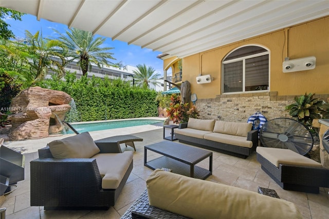 view of patio / terrace featuring an outdoor living space and a fenced in pool