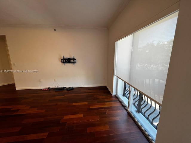 unfurnished room with dark hardwood / wood-style flooring and ornamental molding