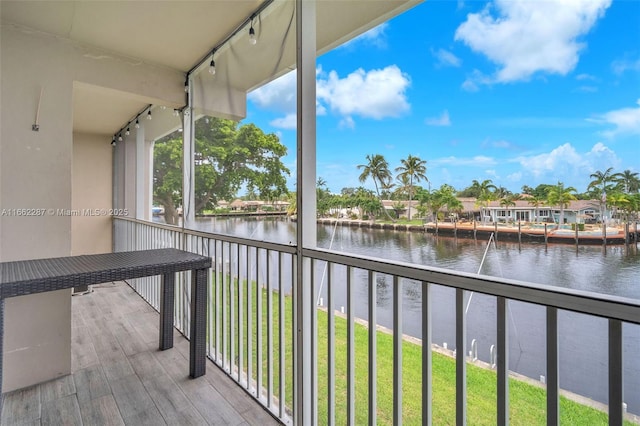 balcony featuring a water view