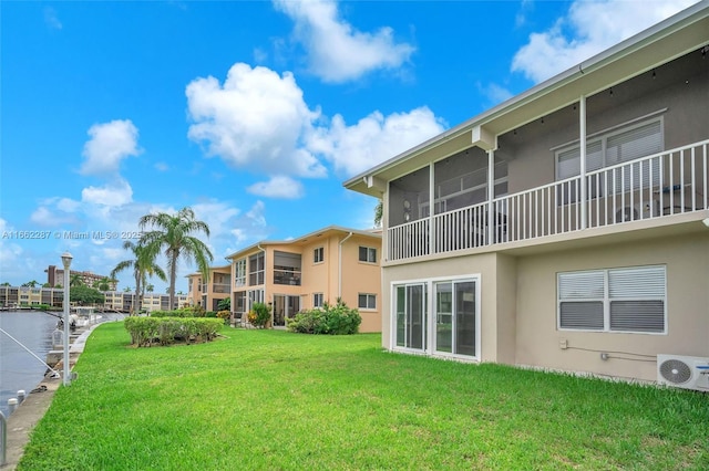 exterior space featuring ac unit and a water view