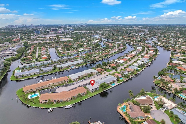 birds eye view of property with a water view and a residential view