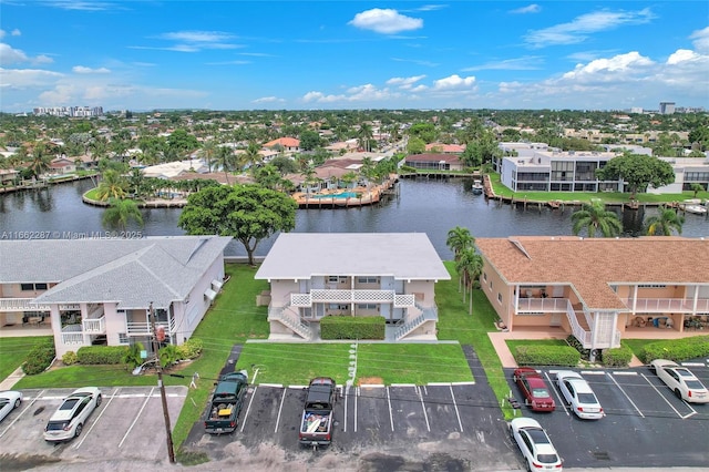 birds eye view of property with a residential view and a water view