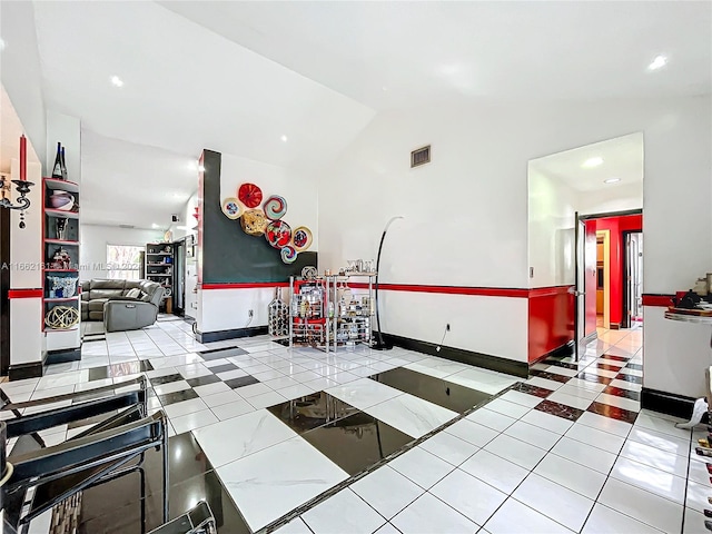 recreation room featuring lofted ceiling