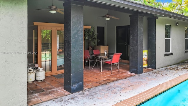 view of patio featuring ceiling fan and french doors