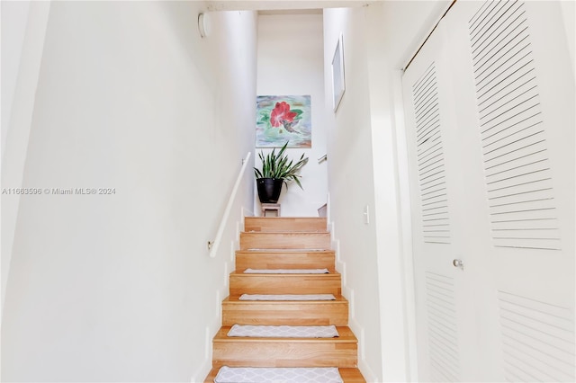 stairs with wood-type flooring