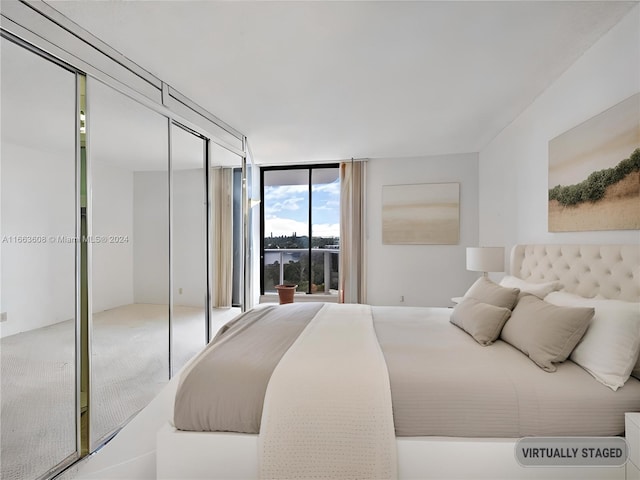 bedroom featuring a wall of windows