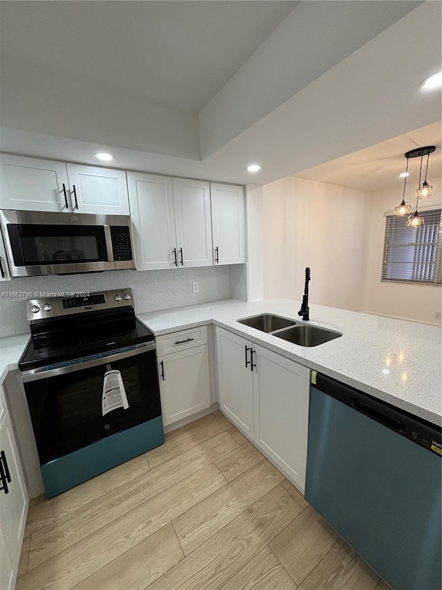 kitchen featuring white cabinetry, sink, and stainless steel appliances