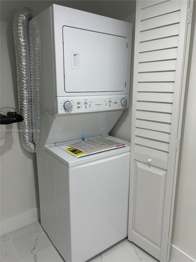 laundry room featuring stacked washer and dryer