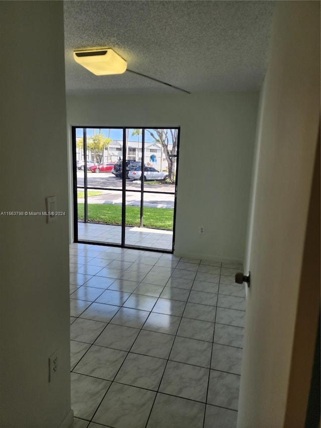 view of tiled spare room