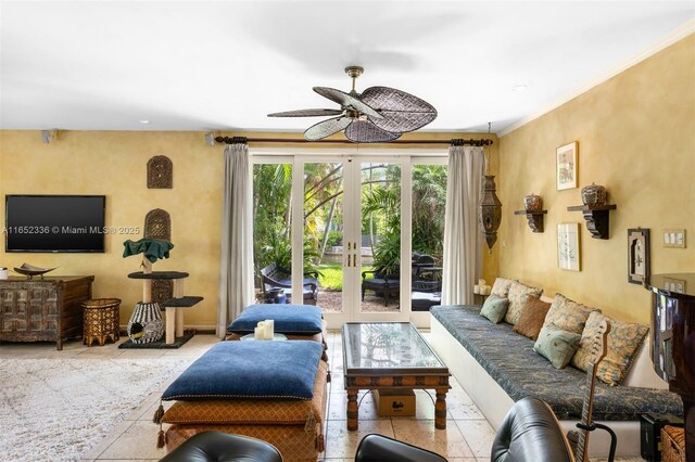 living room featuring french doors, ceiling fan, and light tile patterned floors