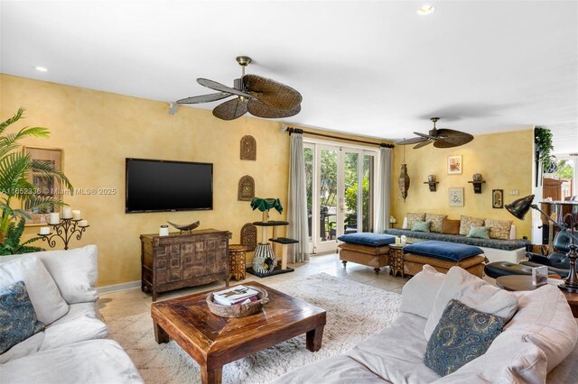 tiled living room featuring ceiling fan