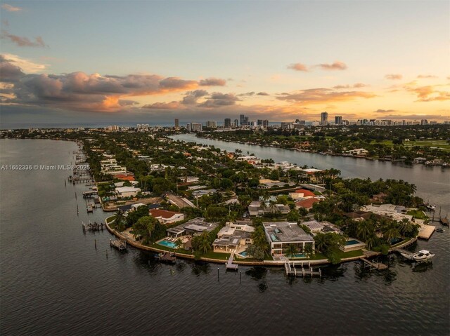 aerial view at dusk with a water view