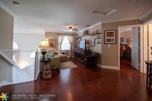 living room featuring ornamental molding, ceiling fan, and dark hardwood / wood-style flooring