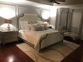 bedroom with ceiling fan and hardwood / wood-style flooring