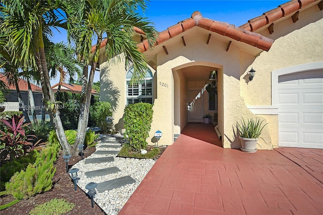 entrance to property featuring a garage