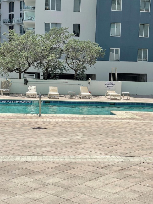 view of pool featuring a patio