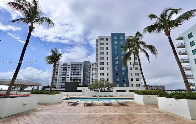 view of swimming pool with a patio