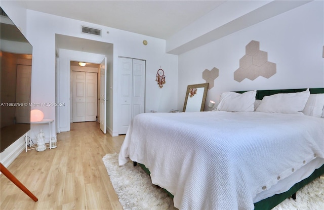 bedroom with light hardwood / wood-style floors