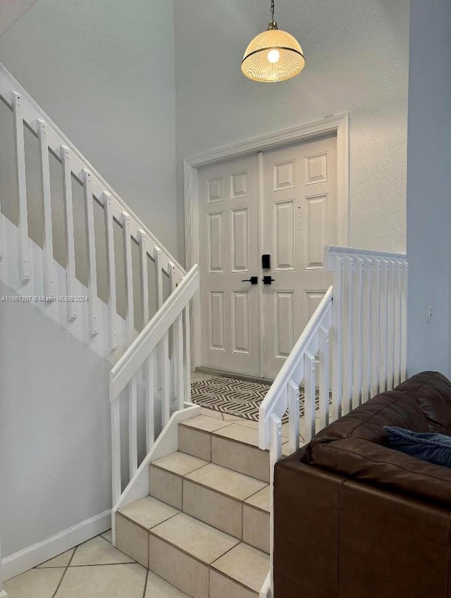 staircase with tile patterned flooring