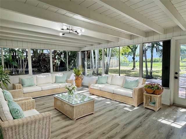 sunroom featuring beam ceiling, wooden ceiling, and an inviting chandelier