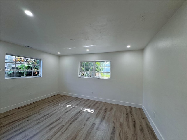 unfurnished room featuring light hardwood / wood-style flooring