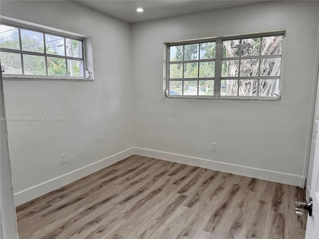 spare room featuring light wood-type flooring