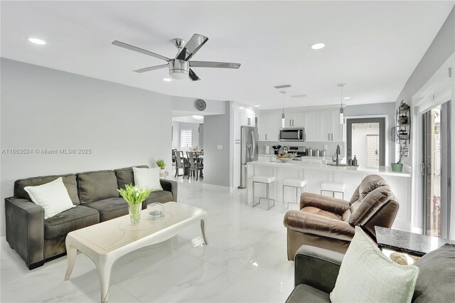 living room featuring plenty of natural light and a high ceiling