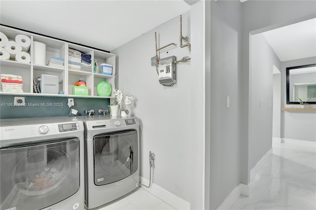 laundry room featuring washing machine and clothes dryer