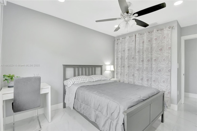 bedroom featuring marble finish floor, a ceiling fan, and baseboards