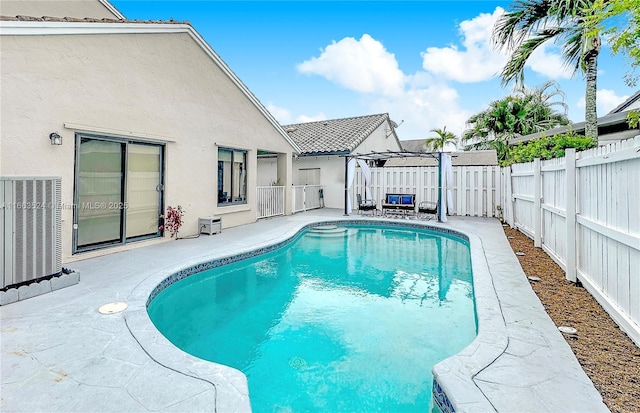 view of swimming pool with a fenced in pool, cooling unit, a patio area, and a fenced backyard