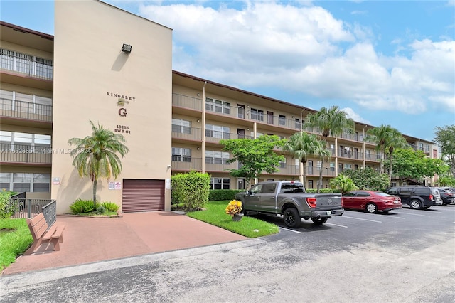 13255 SW 9th Ct Unit 114G, Pembroke Pines, FL 33027 - view of building exterior with uncovered parking