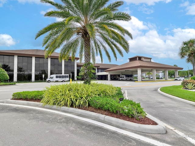 13255 SW 9th Ct Unit 114G, Pembroke Pines, FL 33027 - view of building exterior featuring covered and uncovered parking