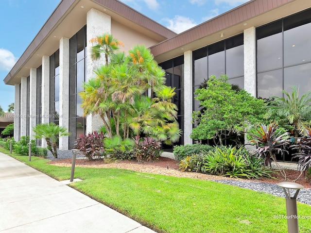 exterior space with a lawn