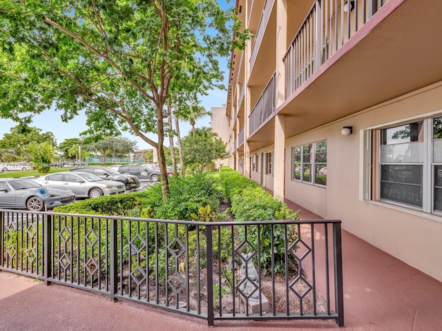 view of patio featuring a balcony