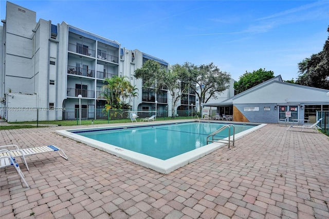 view of swimming pool with a patio