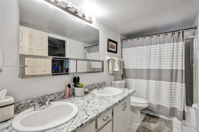 bathroom featuring tile patterned flooring, vanity, and toilet