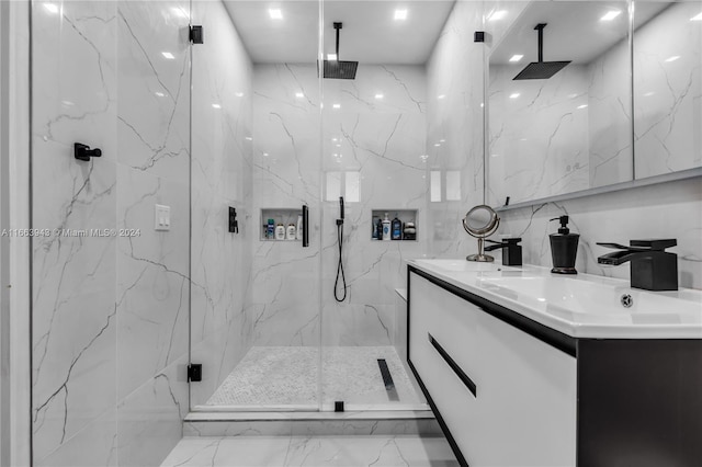 bathroom featuring tile walls, a shower with shower door, and vanity