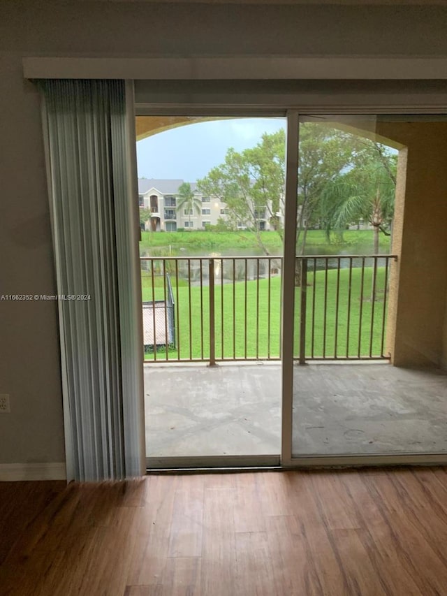 doorway to outside with hardwood / wood-style flooring