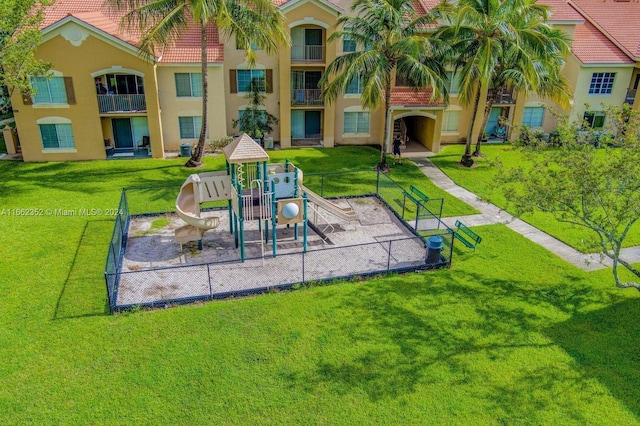 view of jungle gym with a lawn