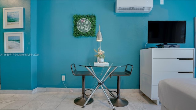 misc room featuring light tile patterned floors and a wall mounted AC