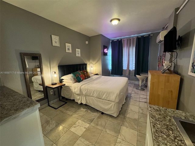 bedroom featuring a wall mounted air conditioner