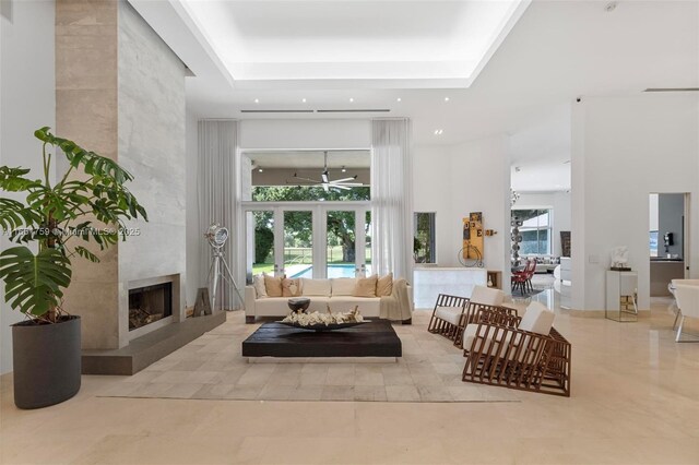 living room with a high ceiling and french doors