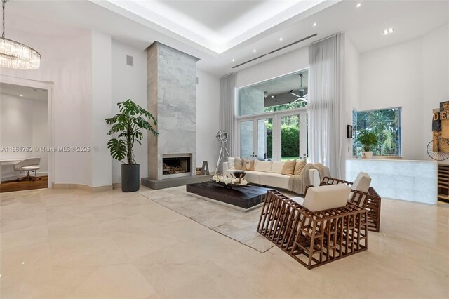 interior space with a high ceiling, tile patterned flooring, and plenty of natural light