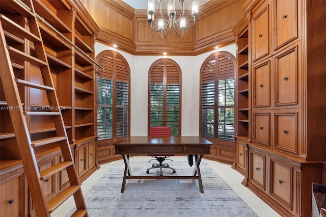 office with an inviting chandelier, a wealth of natural light, wood walls, and crown molding