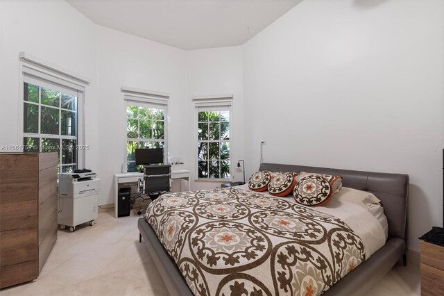 carpeted bedroom featuring ensuite bath and a closet